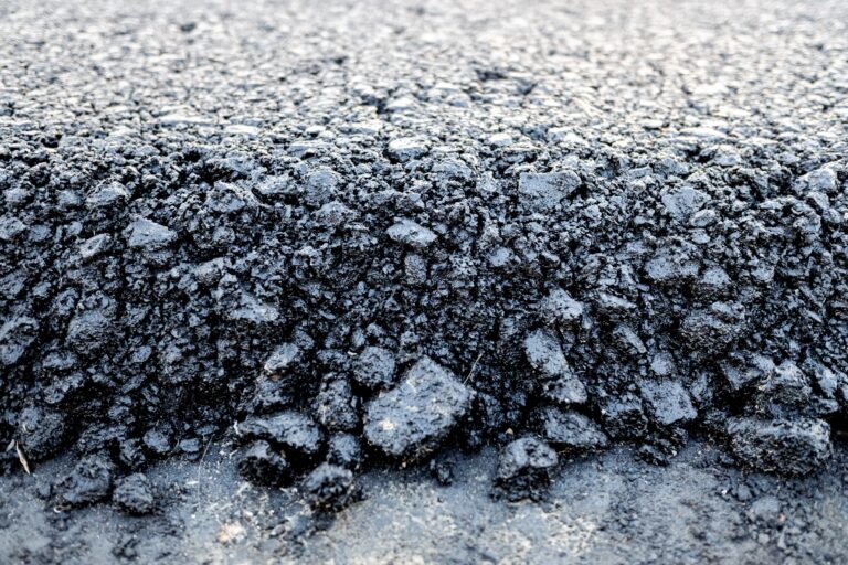 Asphalt layer just spread on a new road, detail