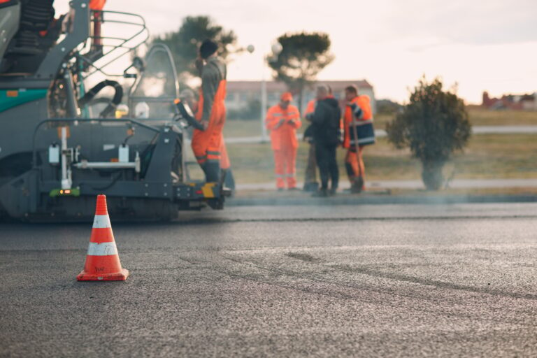 Asphalt paving. Paver machine and workers. New road construction.