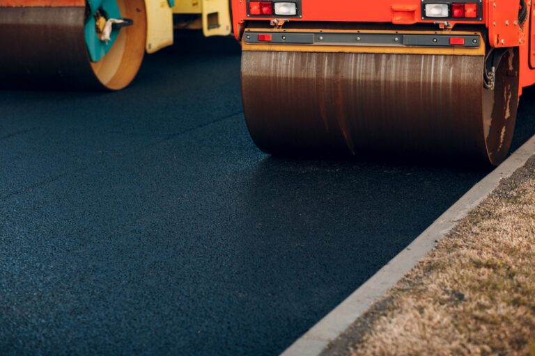 Asphalt paving. Paver machine and workers. New road construction.