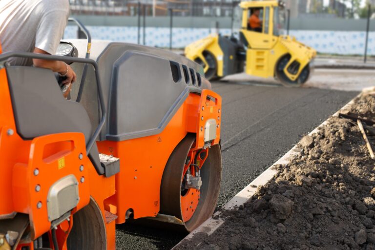 Road construction, asphalt concrete roller presses hot asphalt. A device for laying asphalt.