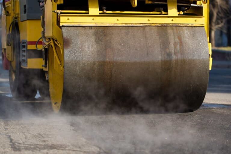 Road roller compacting asphalt