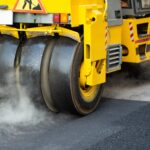 Steamroller flatten out the asphalt