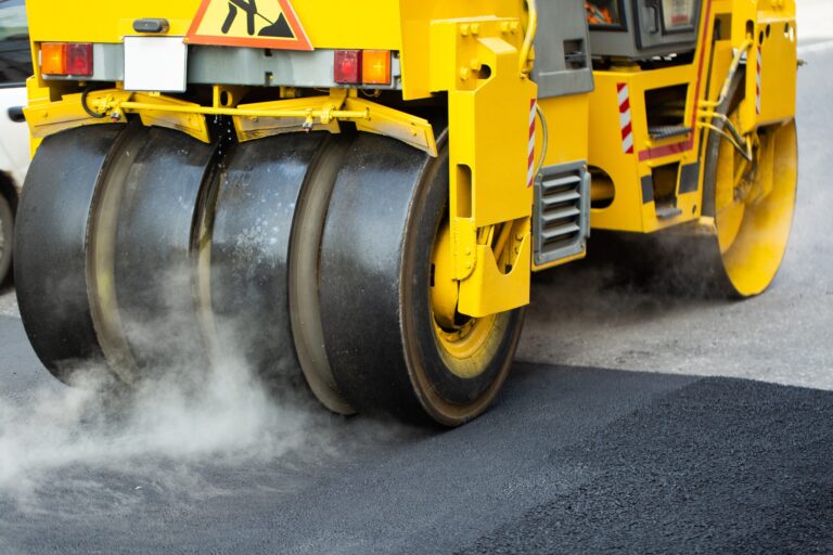 Steamroller flatten out the asphalt