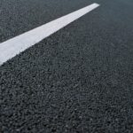 White dotted line on city asphalt road background