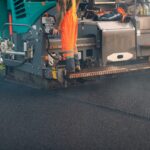 Asphalt paving. Paver machine and workers. New road construction.