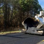 Industrial machinery working with asphal industrial laying fresh asphalt