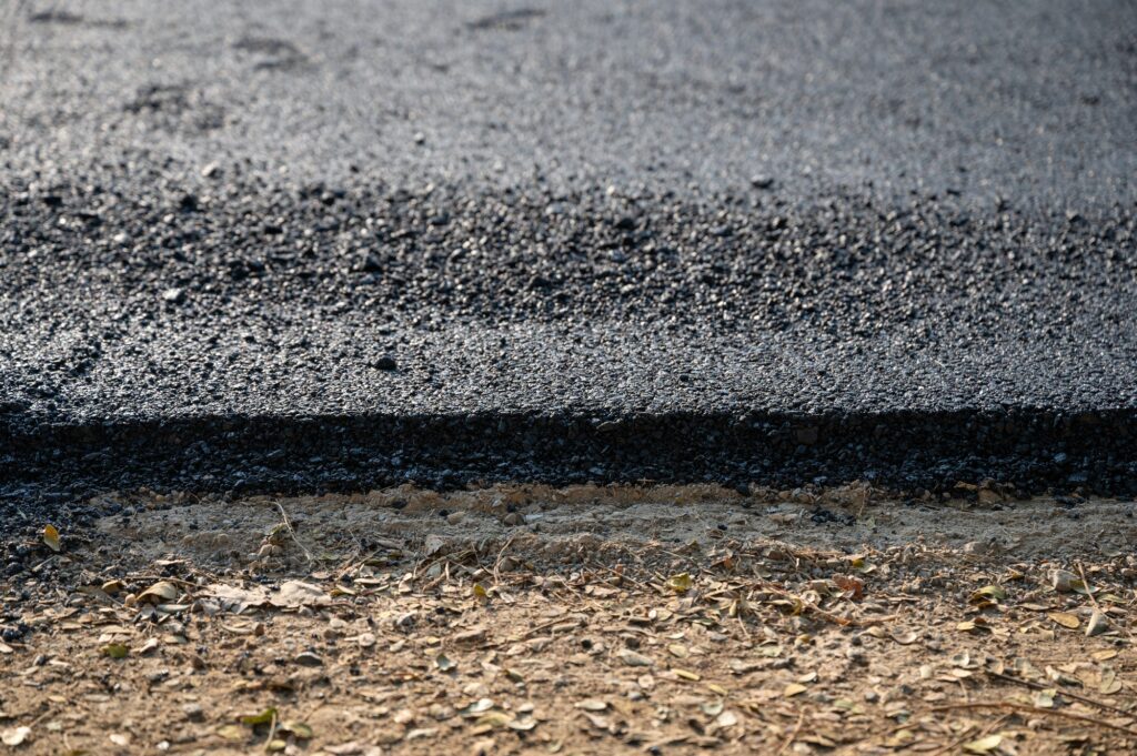 New asphalt tarmac texture road of repairing on the damaged highway