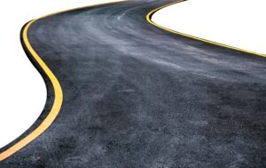 Winding asphalt road with yellow symbol